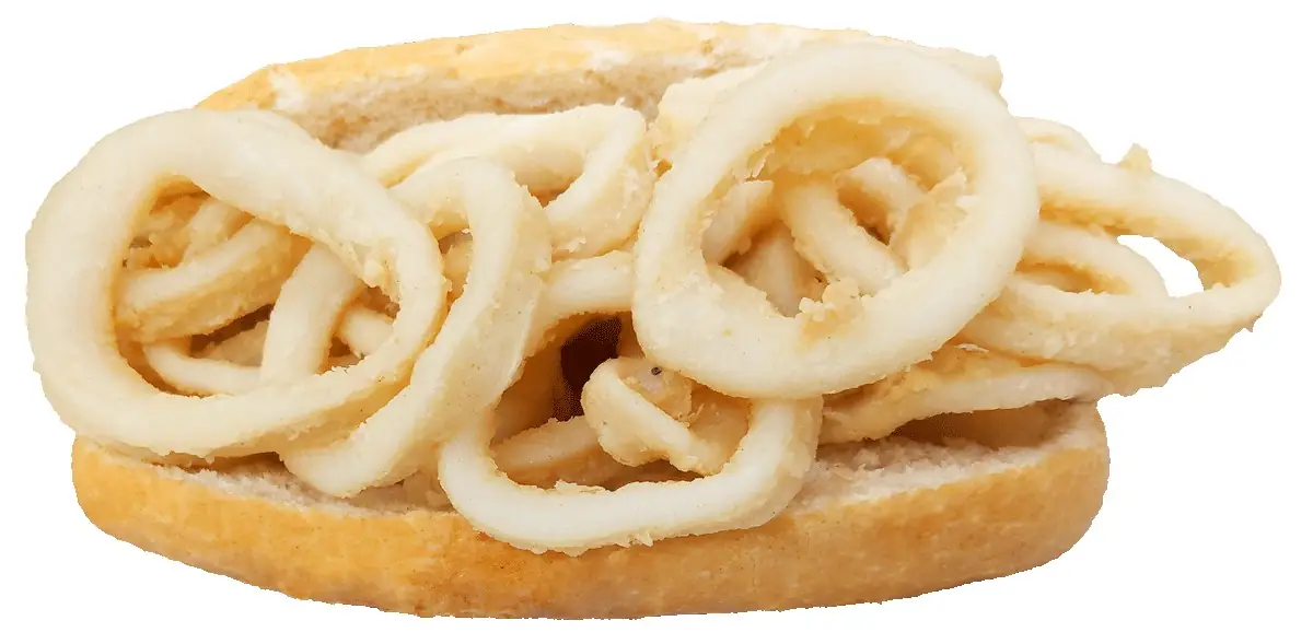 Bocadillo de calamares: a split white roll piled with battered fried squid rings, on a white background