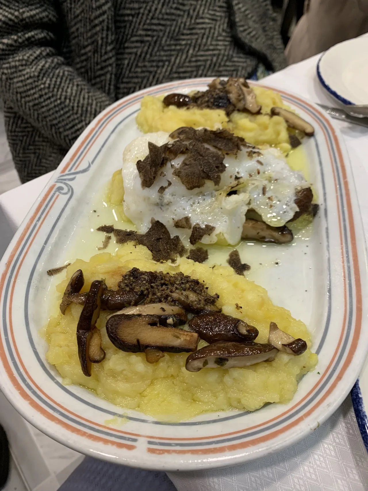 Fried eggs with wild mushrooms and truffle shavings