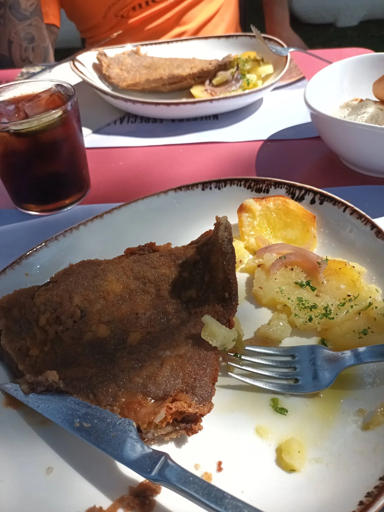 A grilled meat dish served with a savory sauce