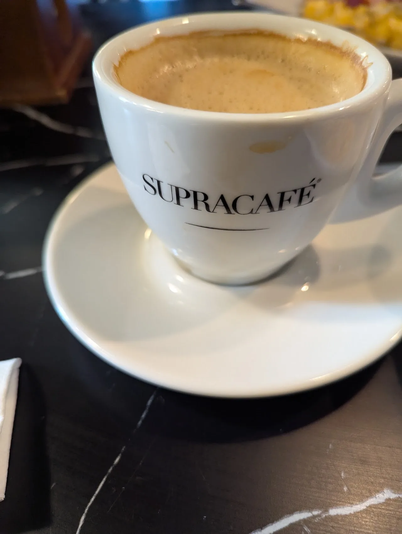 A cup of espresso coffee on a saucer