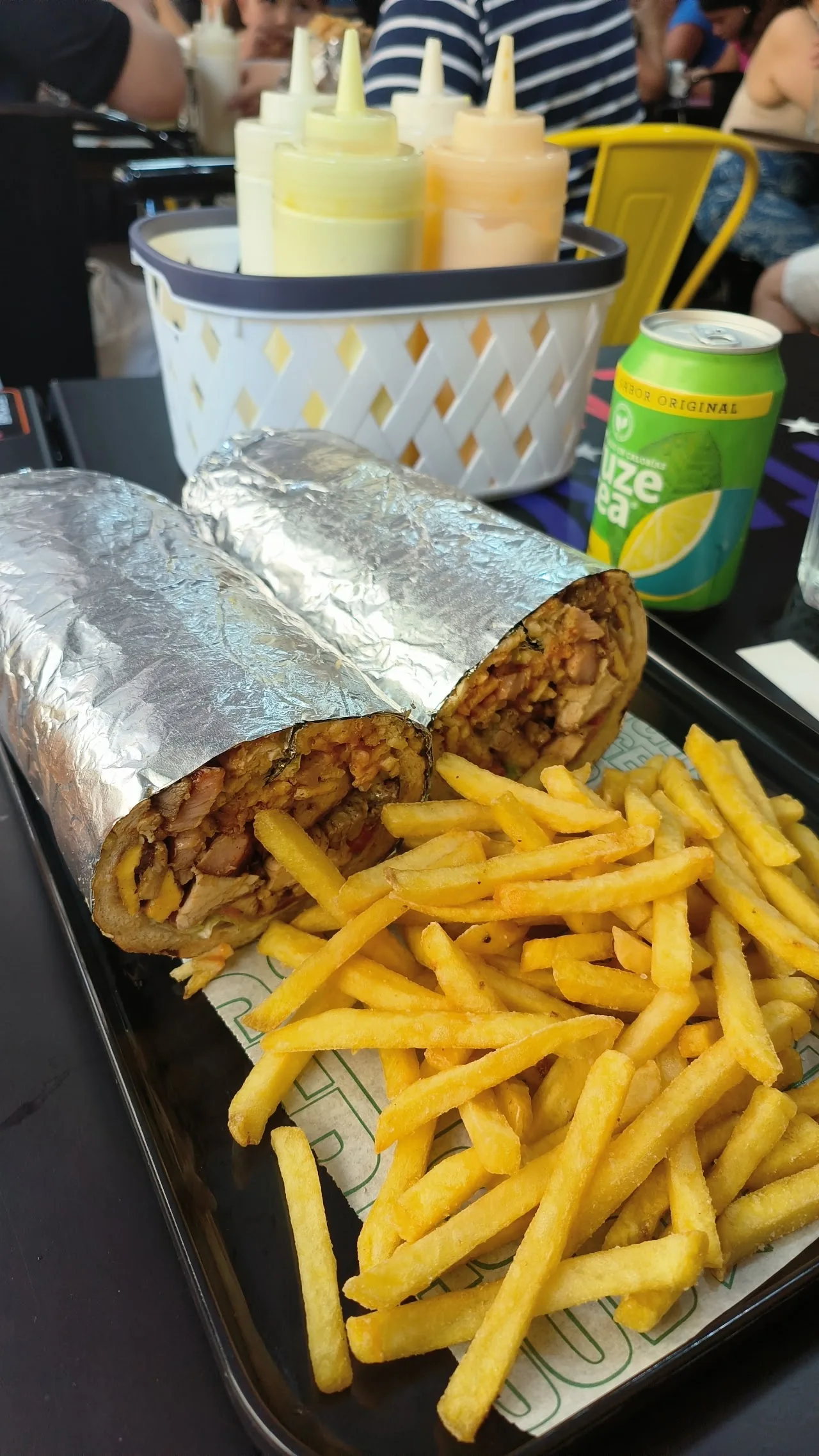 Wrapped burritos served with a side of fries
