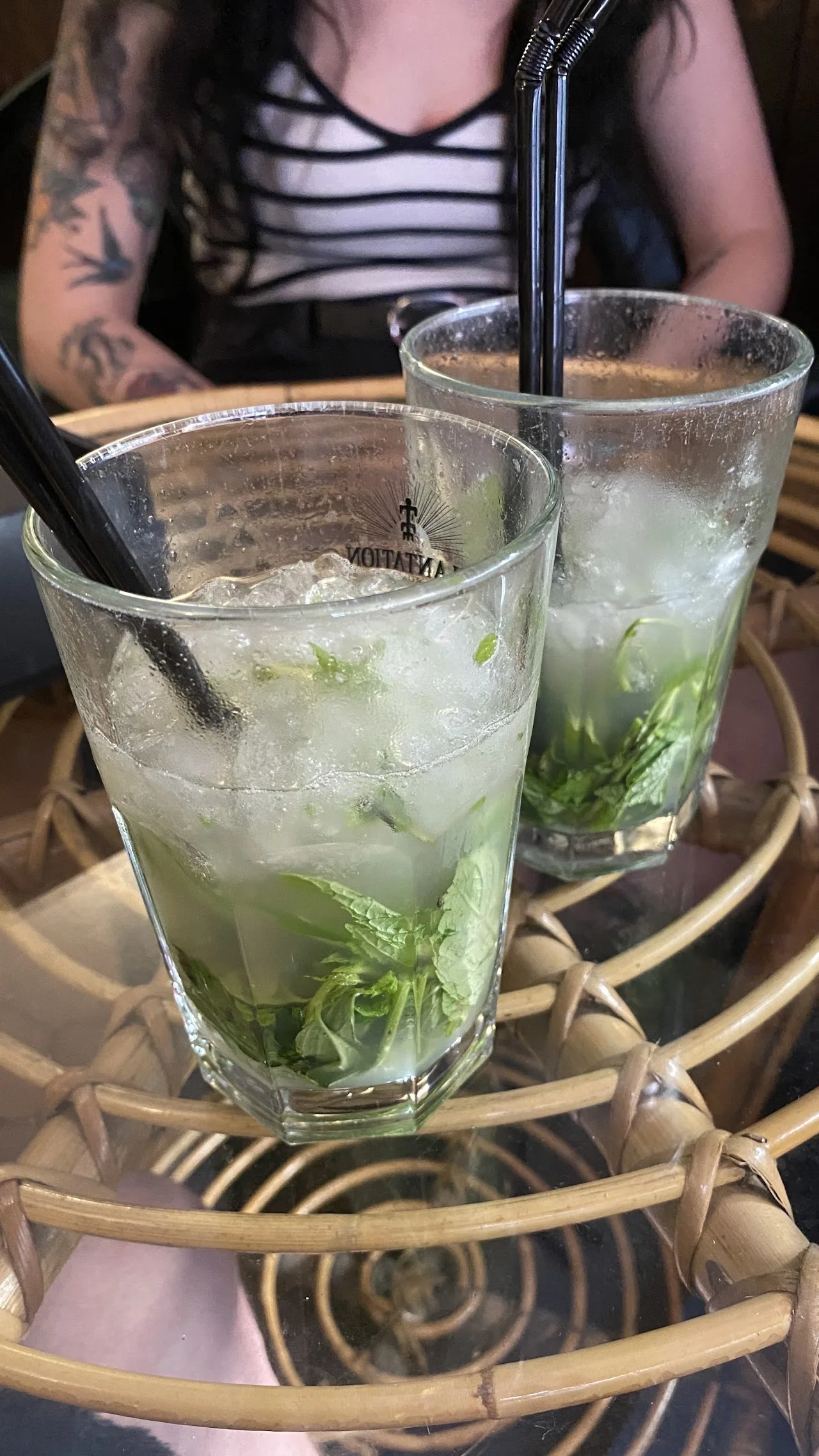 Two mojito cocktails with mint and straws