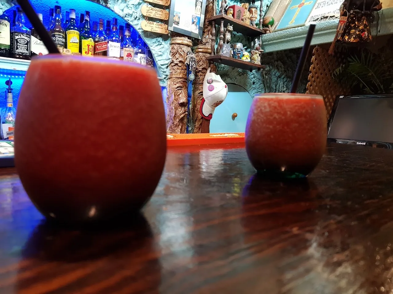 Two frozen red cocktails served in round glasses