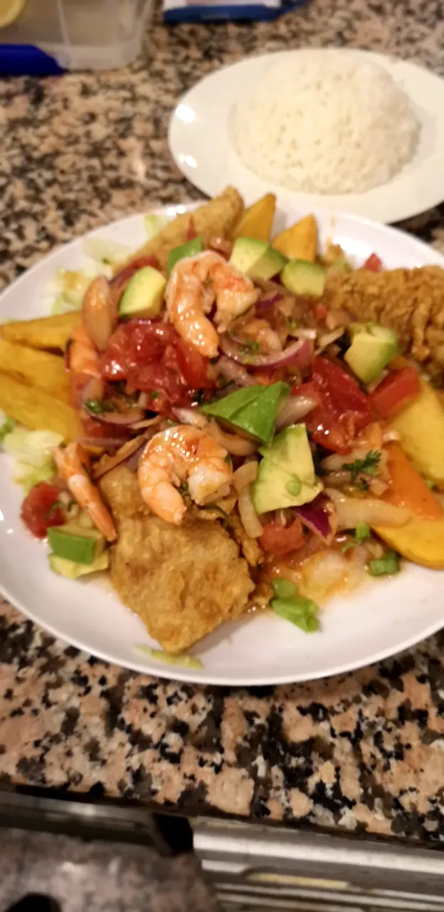 A shrimp and avocado salad plate with rice
