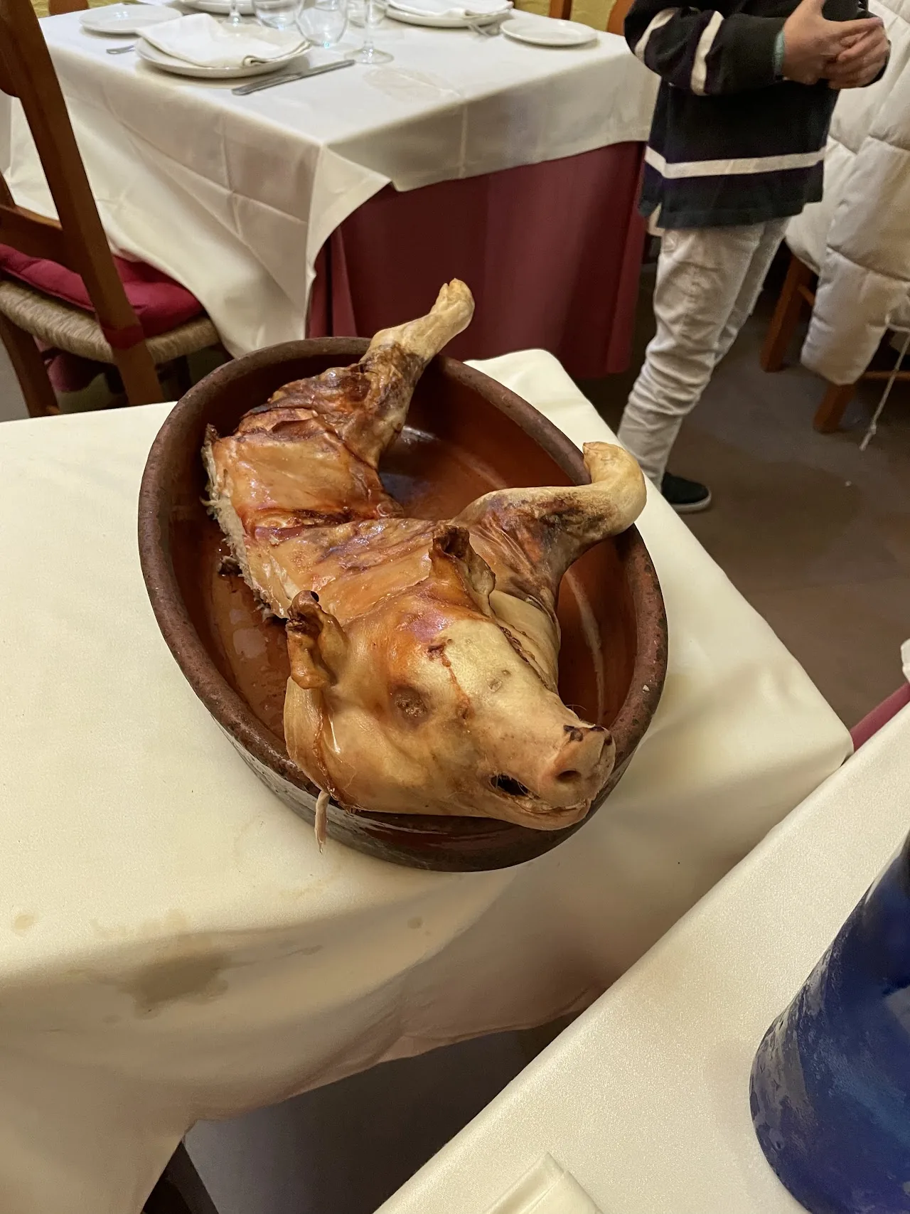 A whole roasted leg of lamb on a serving platter