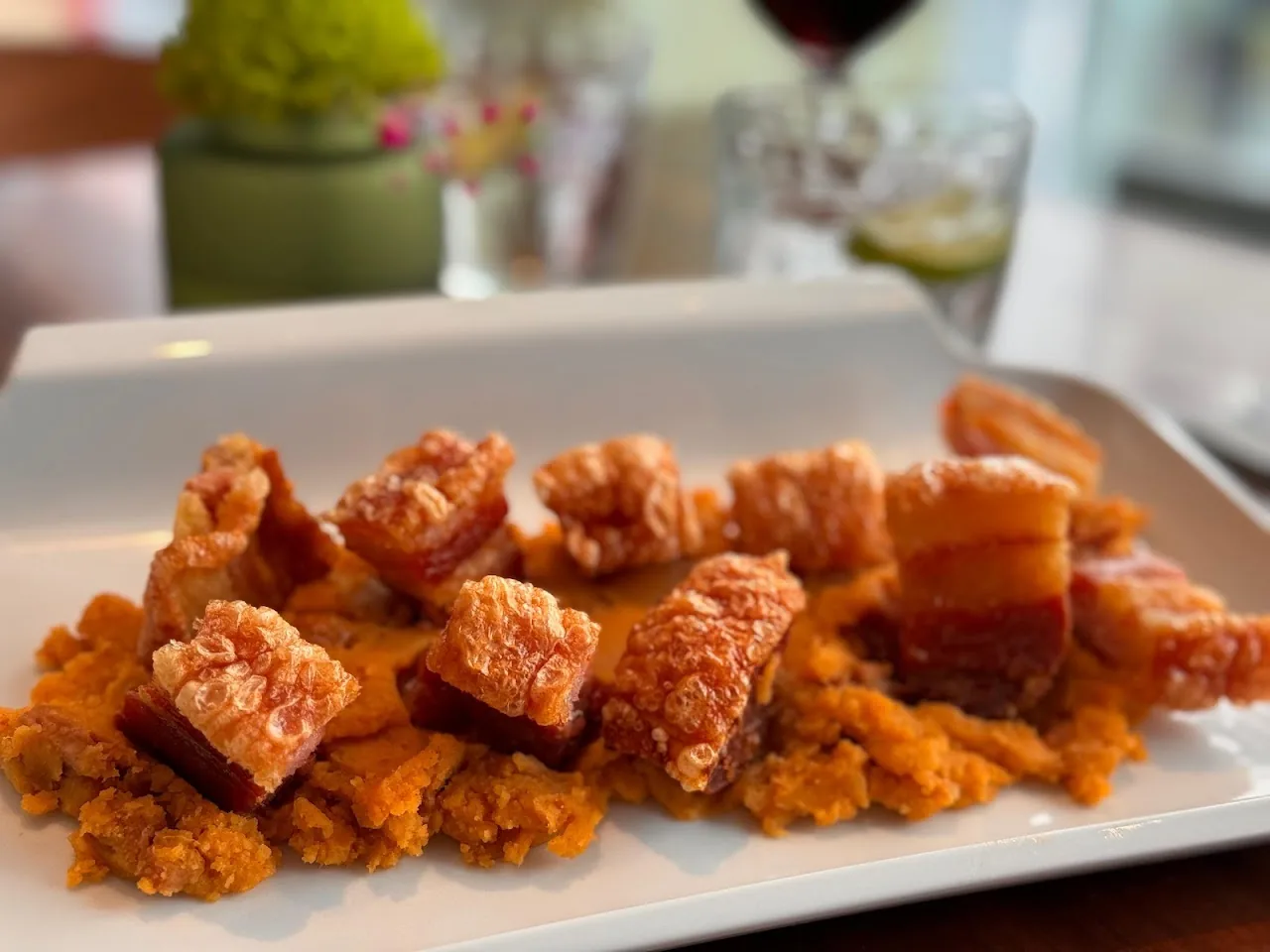 A plate of fried food chunks with breading