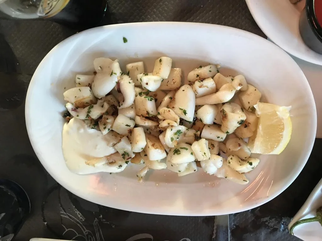 A plate of fried squid Andalusian style with lemon