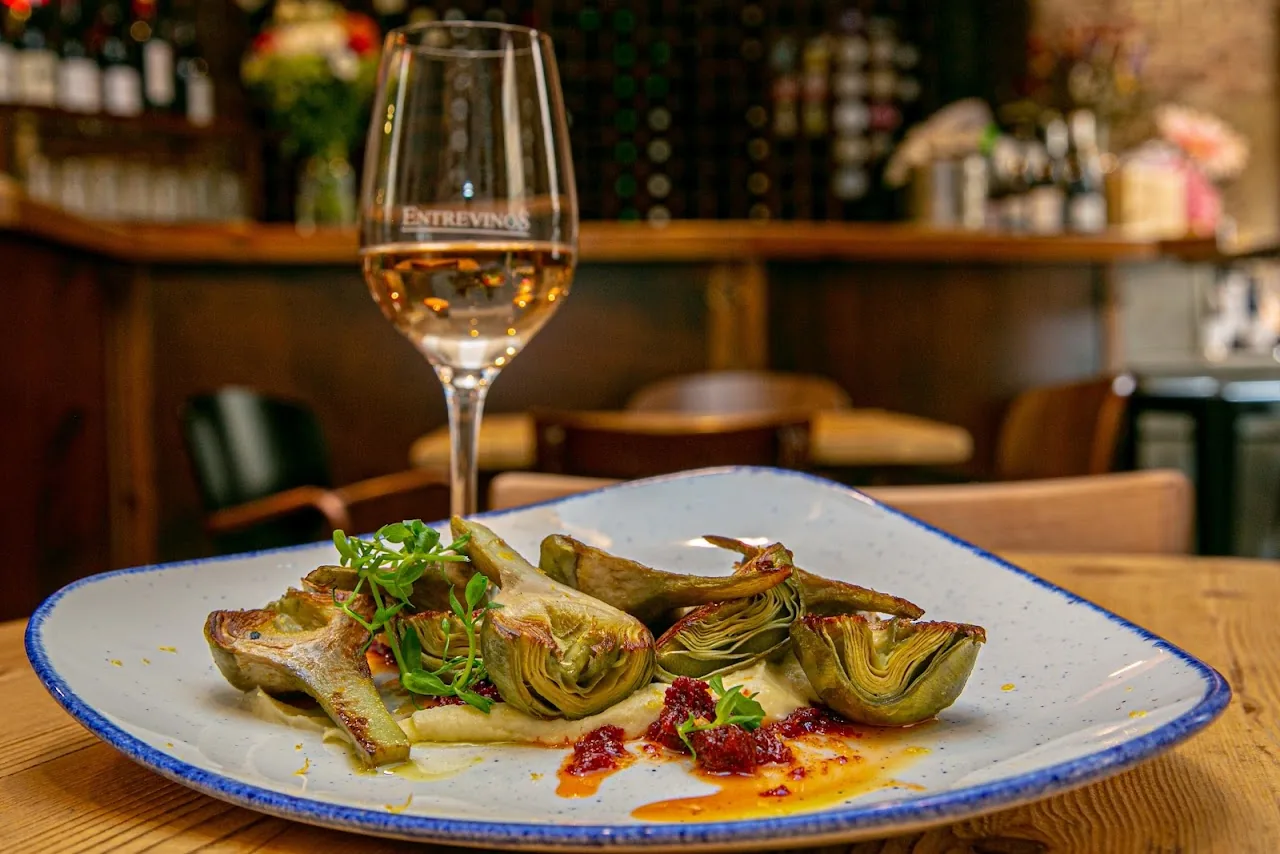 Grilled artichoke halves in a spiced sauce