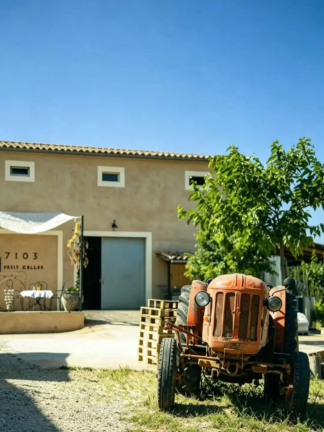A vintage tractor outside the 7103 Petit Celler winery