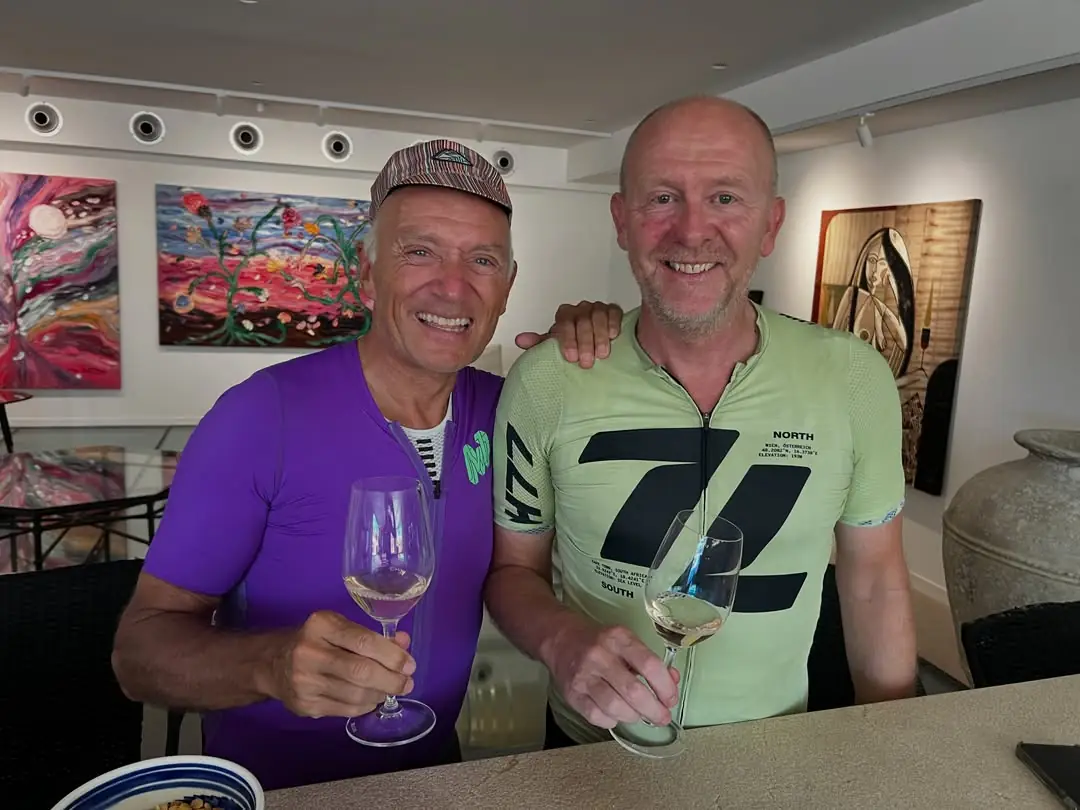 Two guests holding glasses of Binivista wine