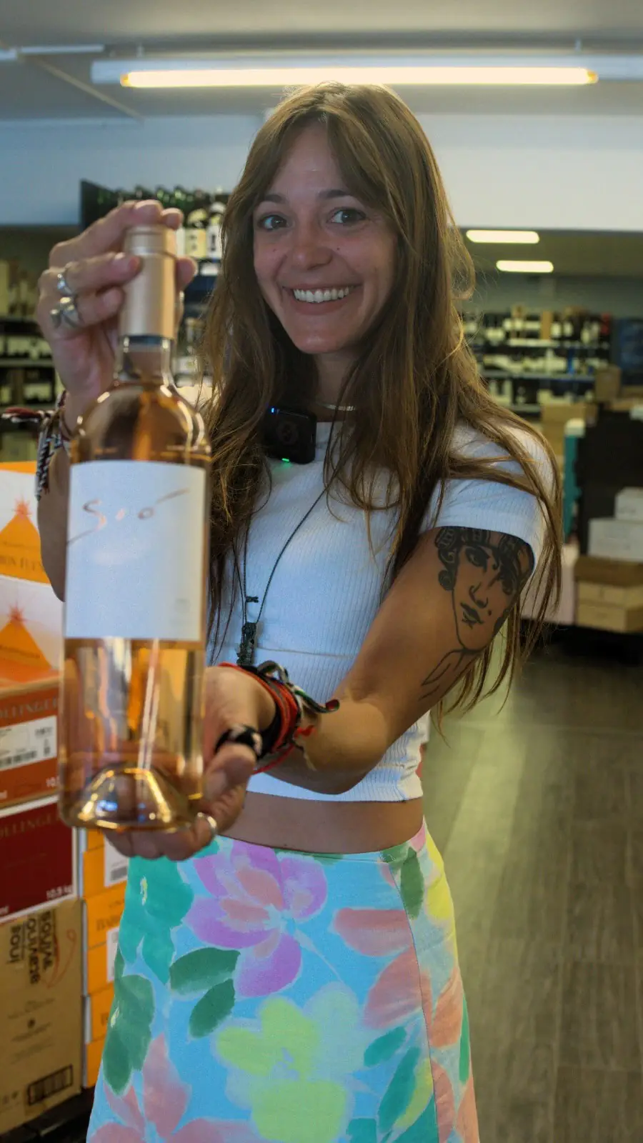 Holding up a bottle of Bodegas Ribas rosé