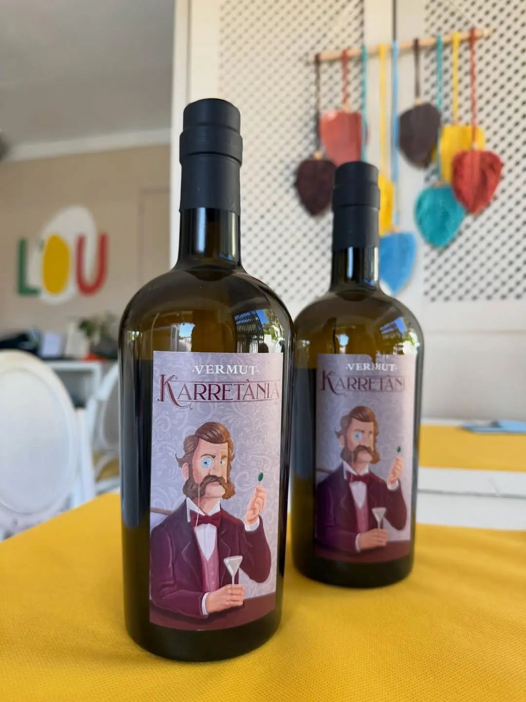 Two bottles of Karretania wine on a table