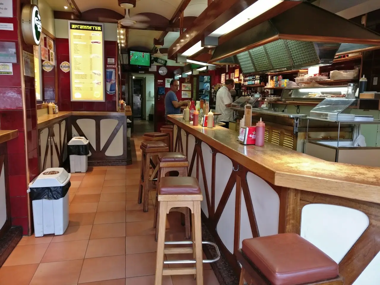 Interior counter with stools and menu boards at Frankfurt Pedralbes.