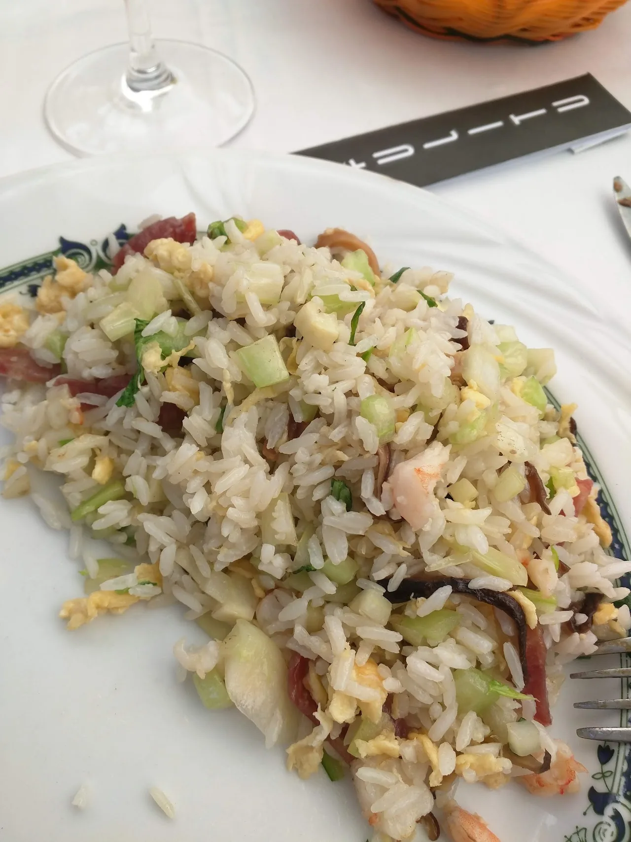 A plate piled with a shredded cold salad of noodles and vegetables