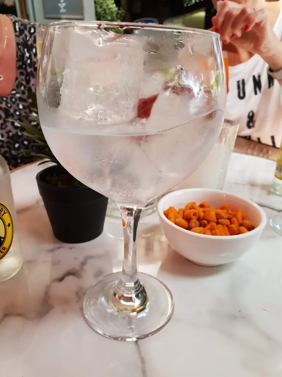 A gin and tonic with snacks at Ginbo