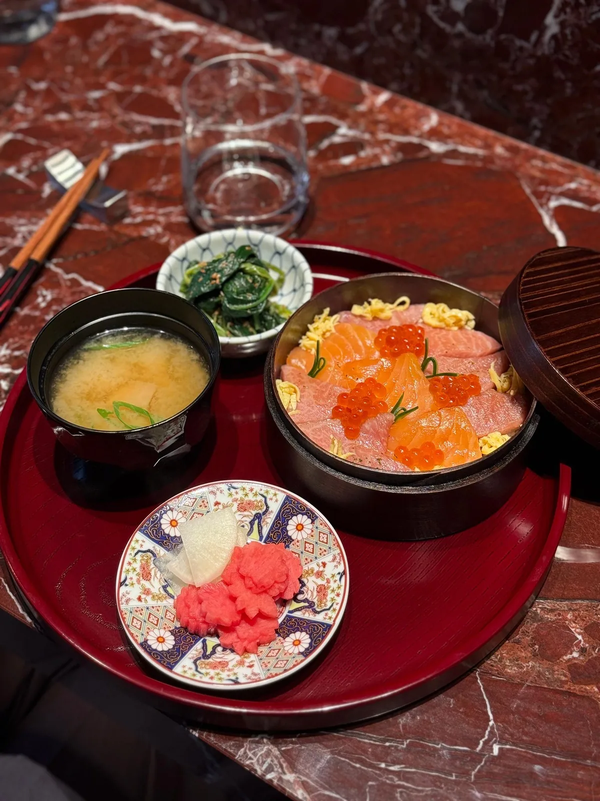 A Japanese tasting set with sashimi, tartare, and miso soup