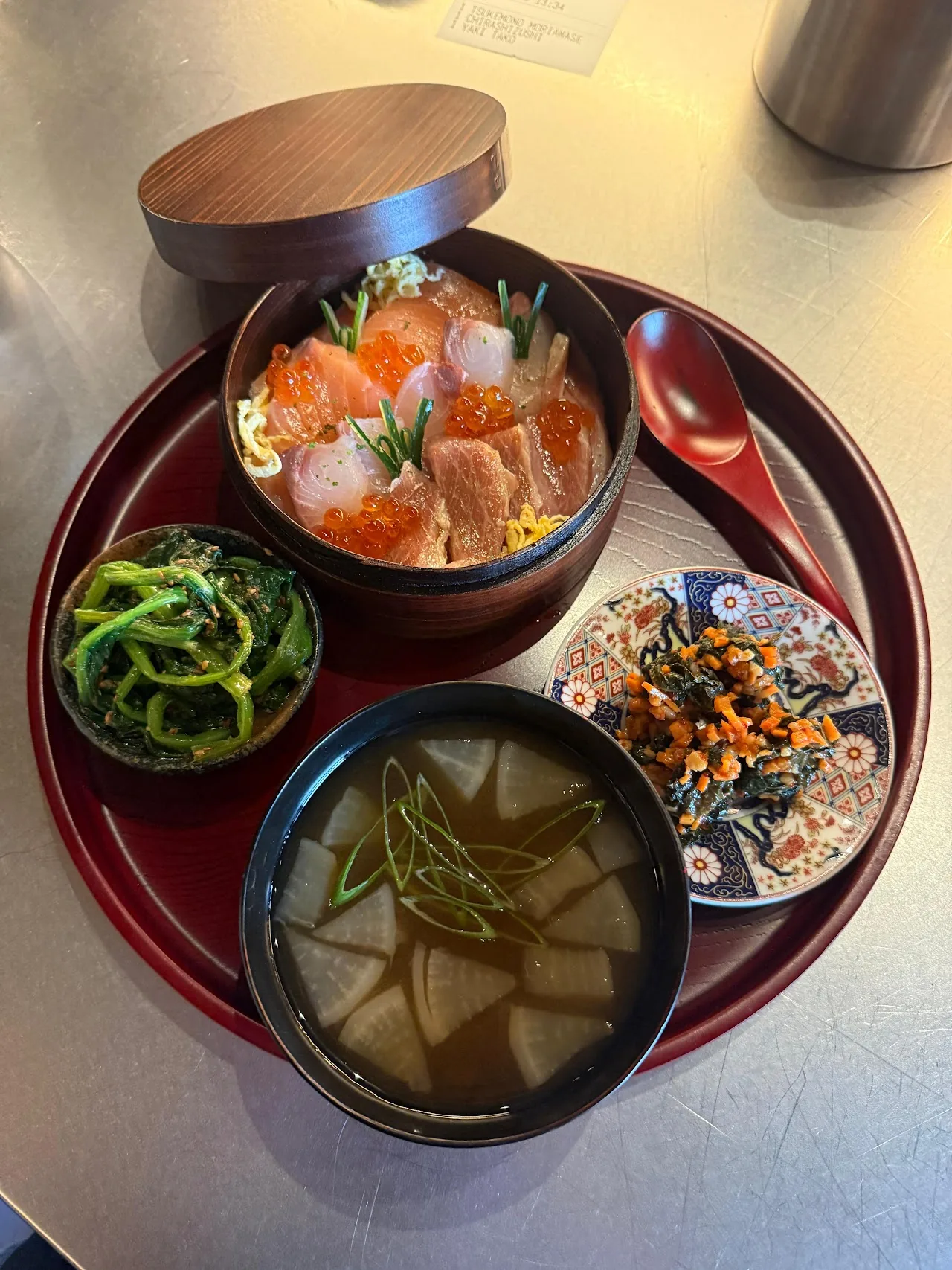 A rice bowl set served with miso soup and small side dishes