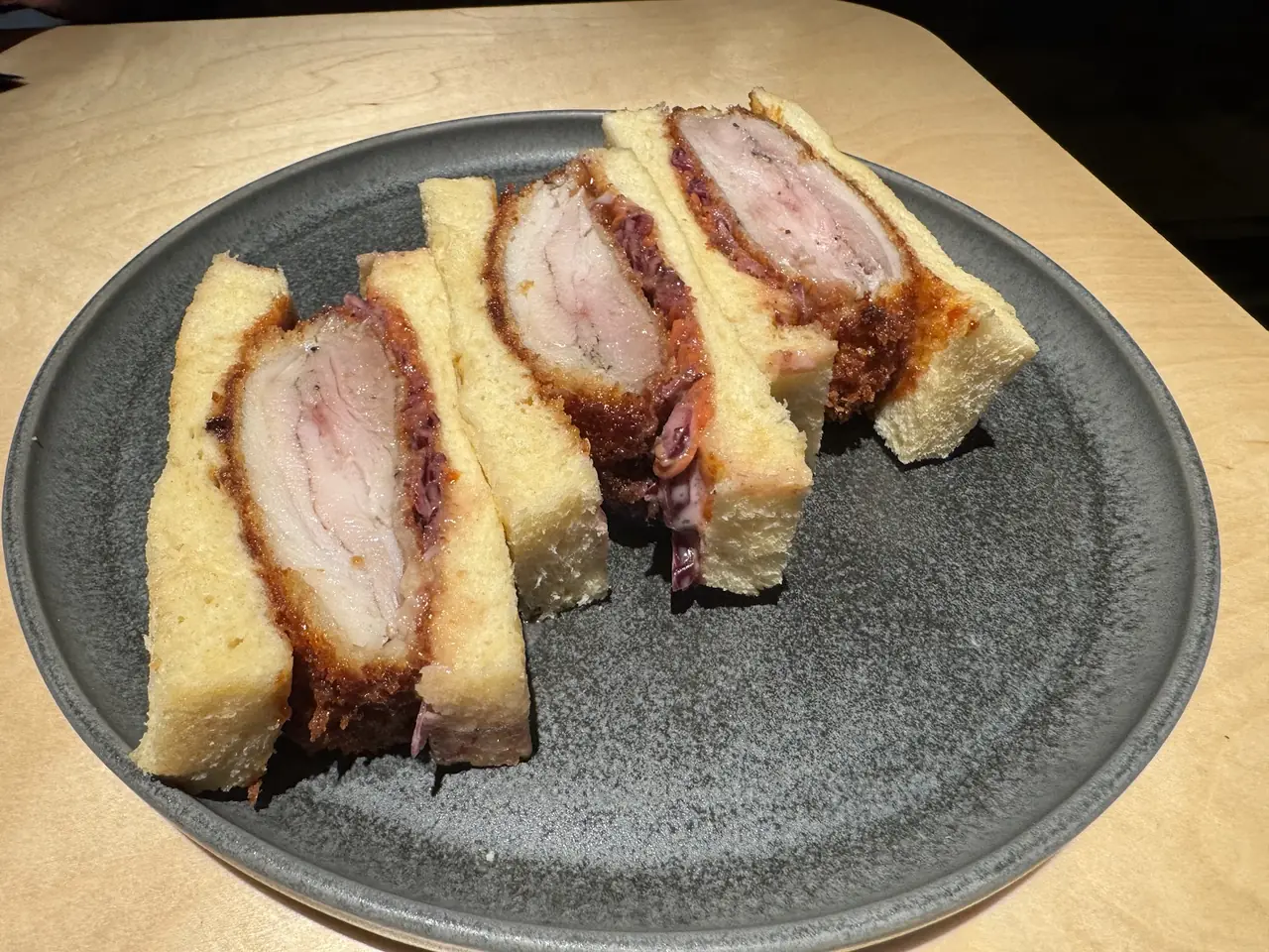 Katsu sando slices with breaded pork cutlet on white bread