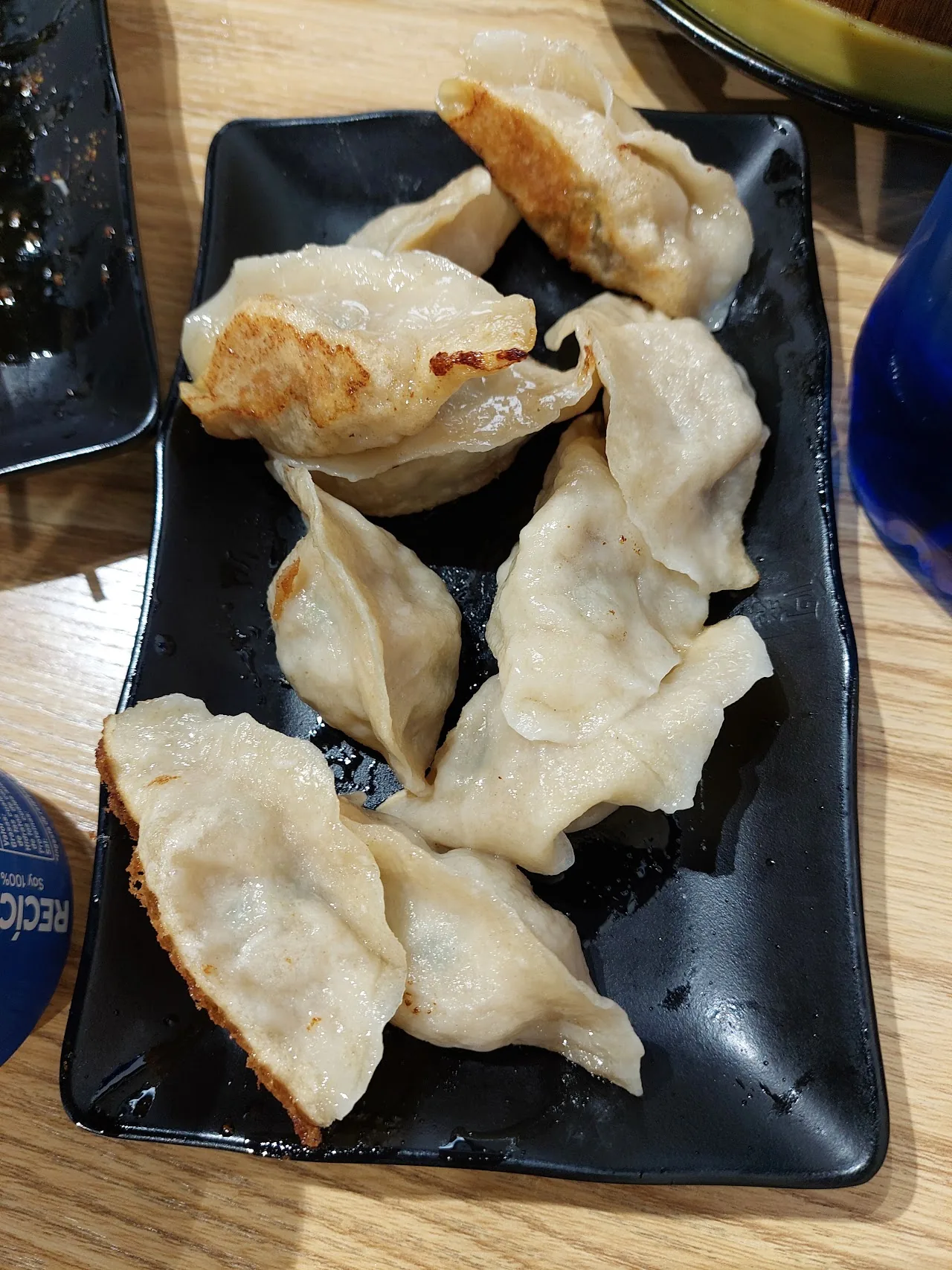 A plate of pan-fried dumplings