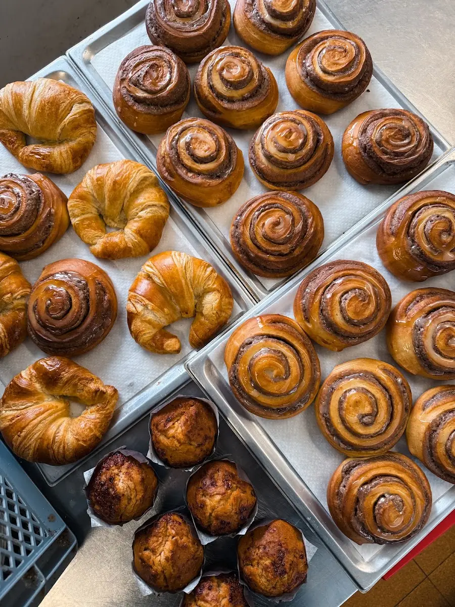Freshly baked cinnamon rolls and croissants at Holibikes Tours & Coffee