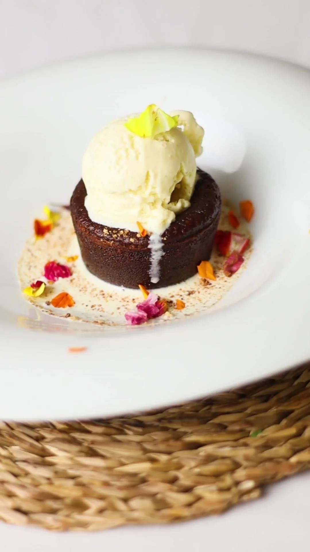 A chocolate dessert with a scoop of vanilla ice cream