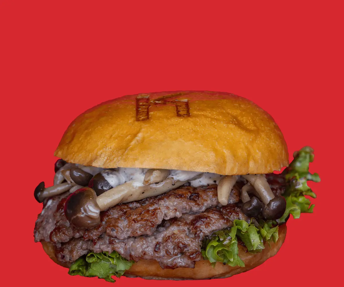 Double beef patty burger topped with sautéed wild mushrooms, creamy sauce and lettuce on a toasted bun, Kemako Japanese Burgers
