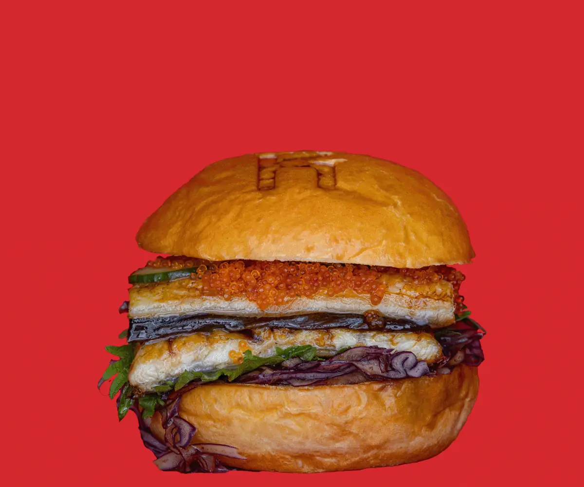 Grilled unagi (eel) burger with fish roe, nori and pickled red cabbage on a toasted bun, Kemako Japanese Burgers