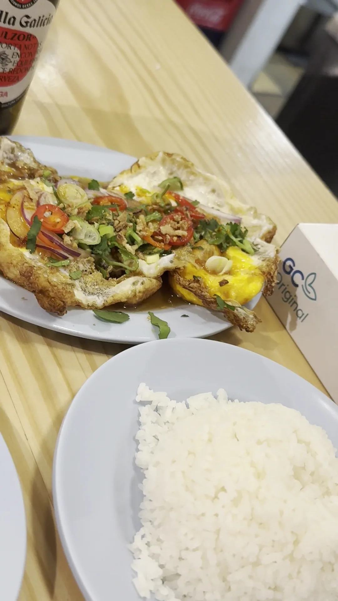 Fried fish with rice on a table
