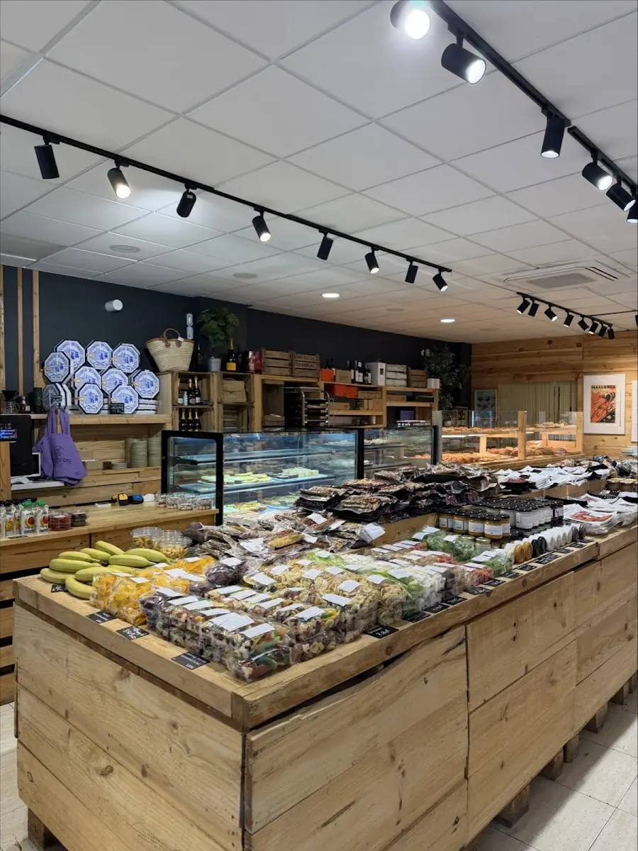 The bakery counter and local-product shelves inside L'Epicerie in Alcúdia