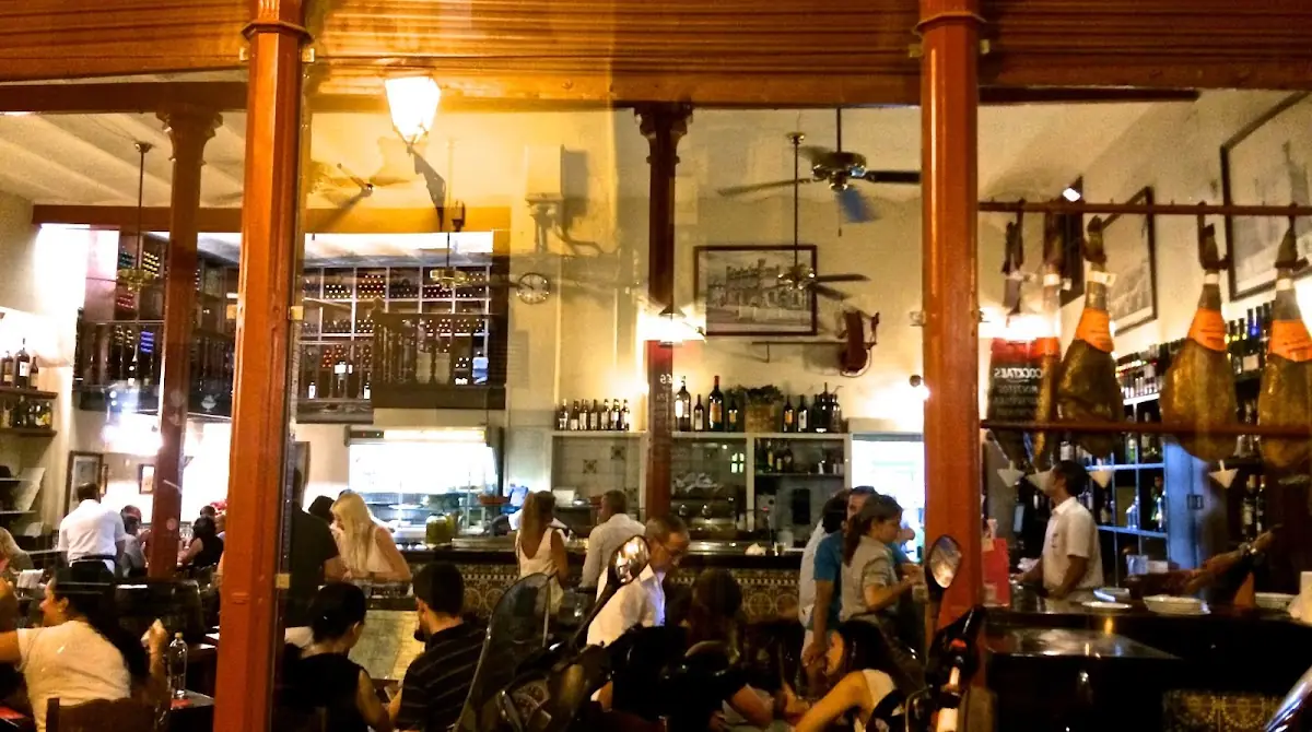 The bustling tavern interior at La Bóveda