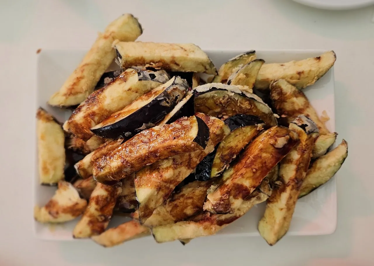 Fried eggplant sticks drizzled with honey