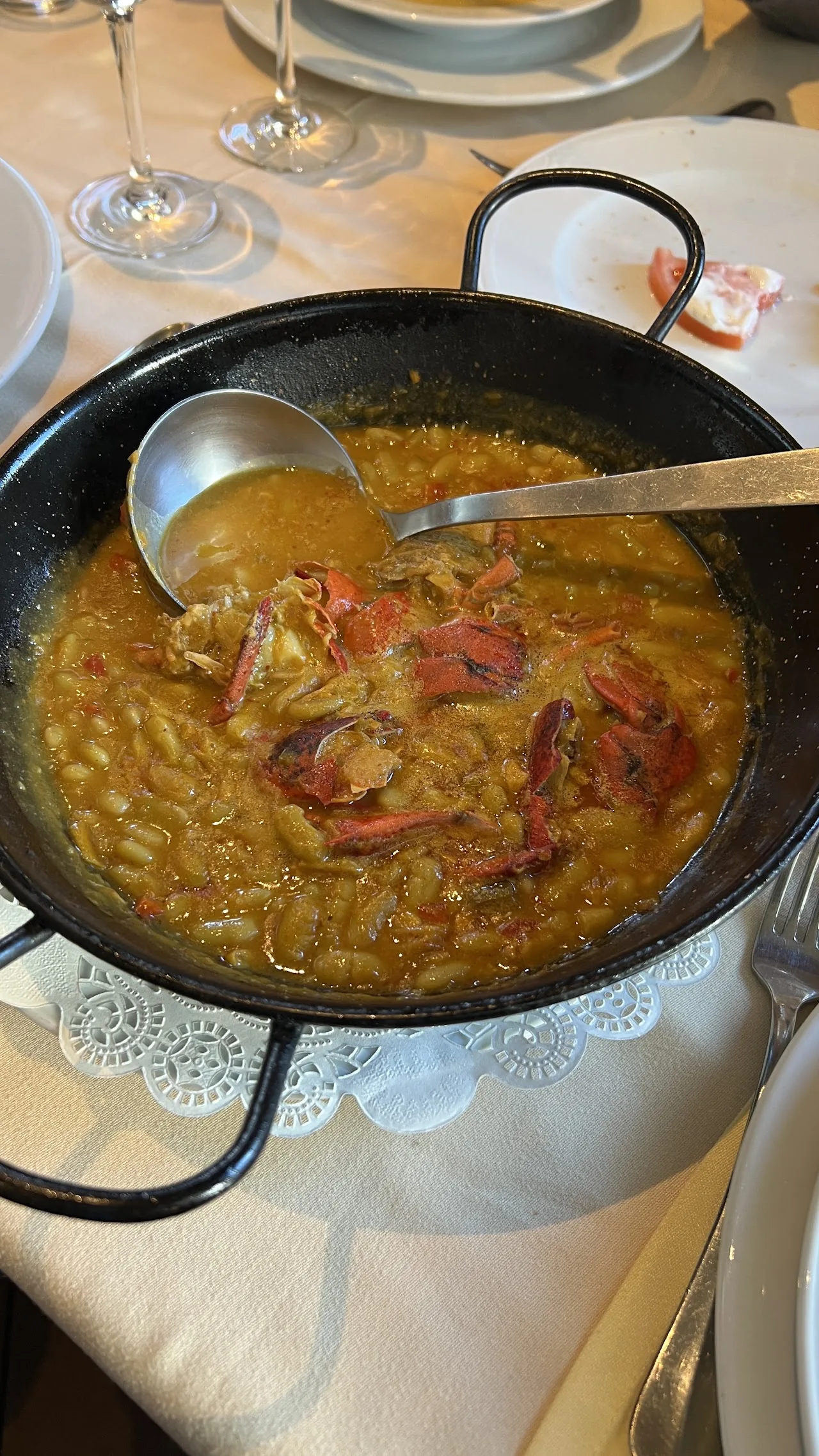 A pan of rice stew being stirred