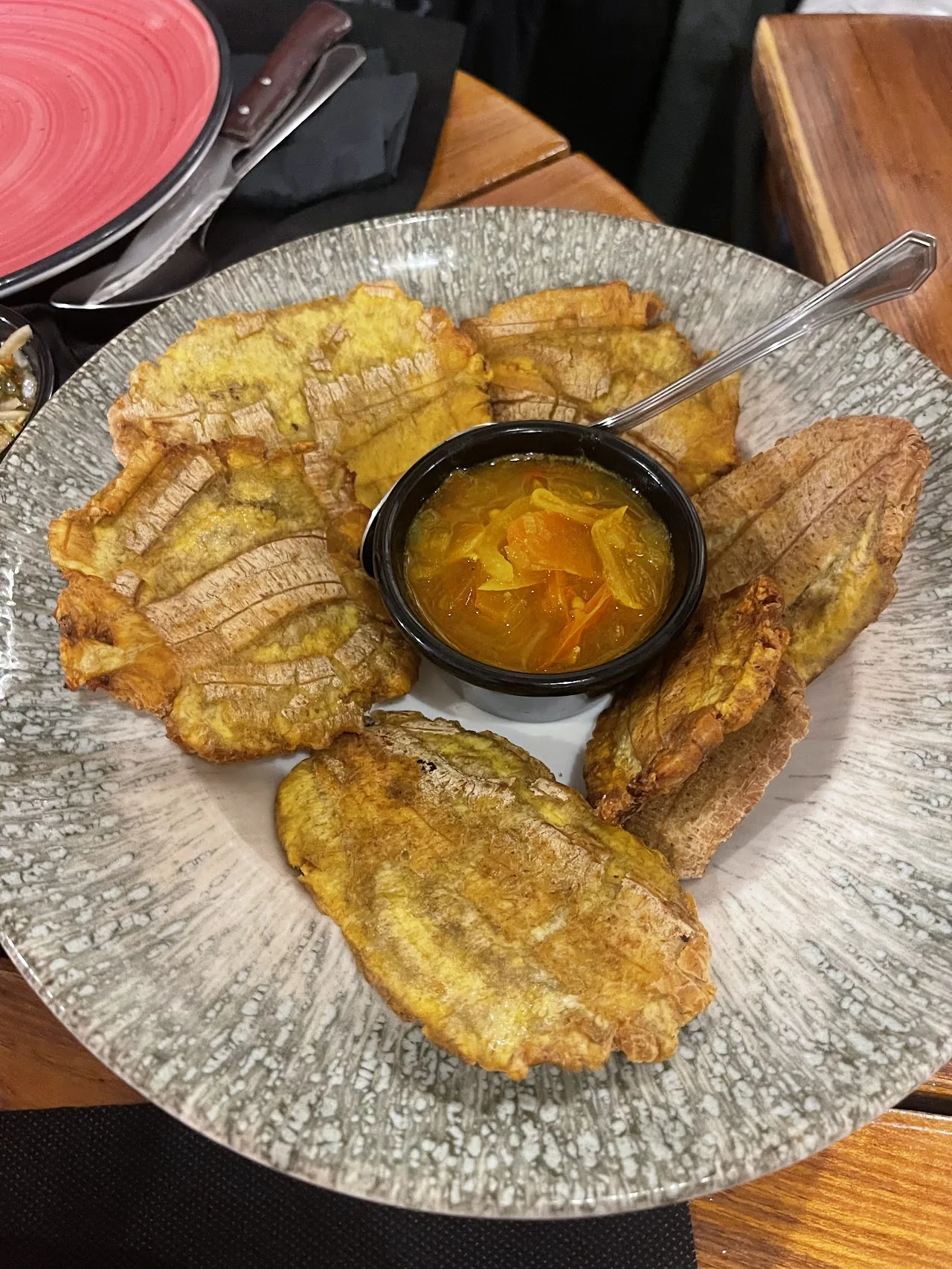 Fried plantains with a side of dipping sauce