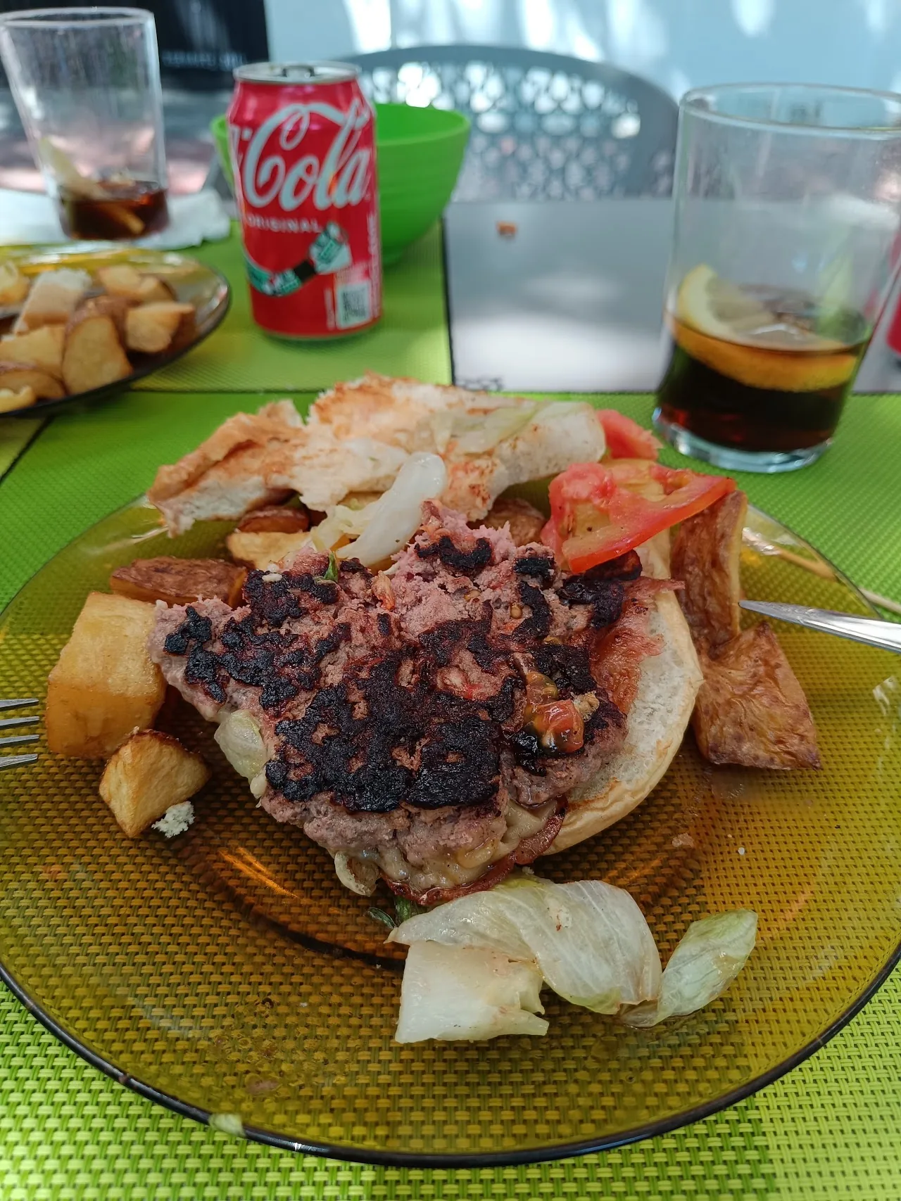An open-face sandwich piled with grilled meat and toppings
