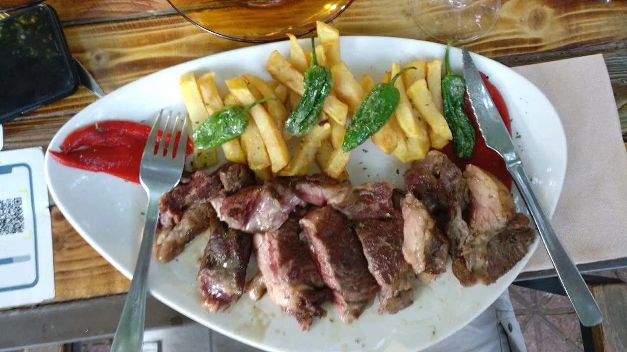 Sliced steak with french fries and green beans