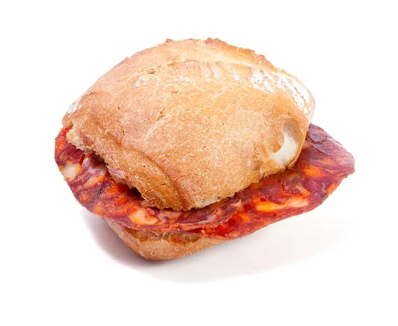 Rustic bread roll filled with slices of cured chorizo