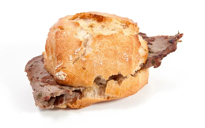 Rustic bread roll filled with slices of grilled loin/beef