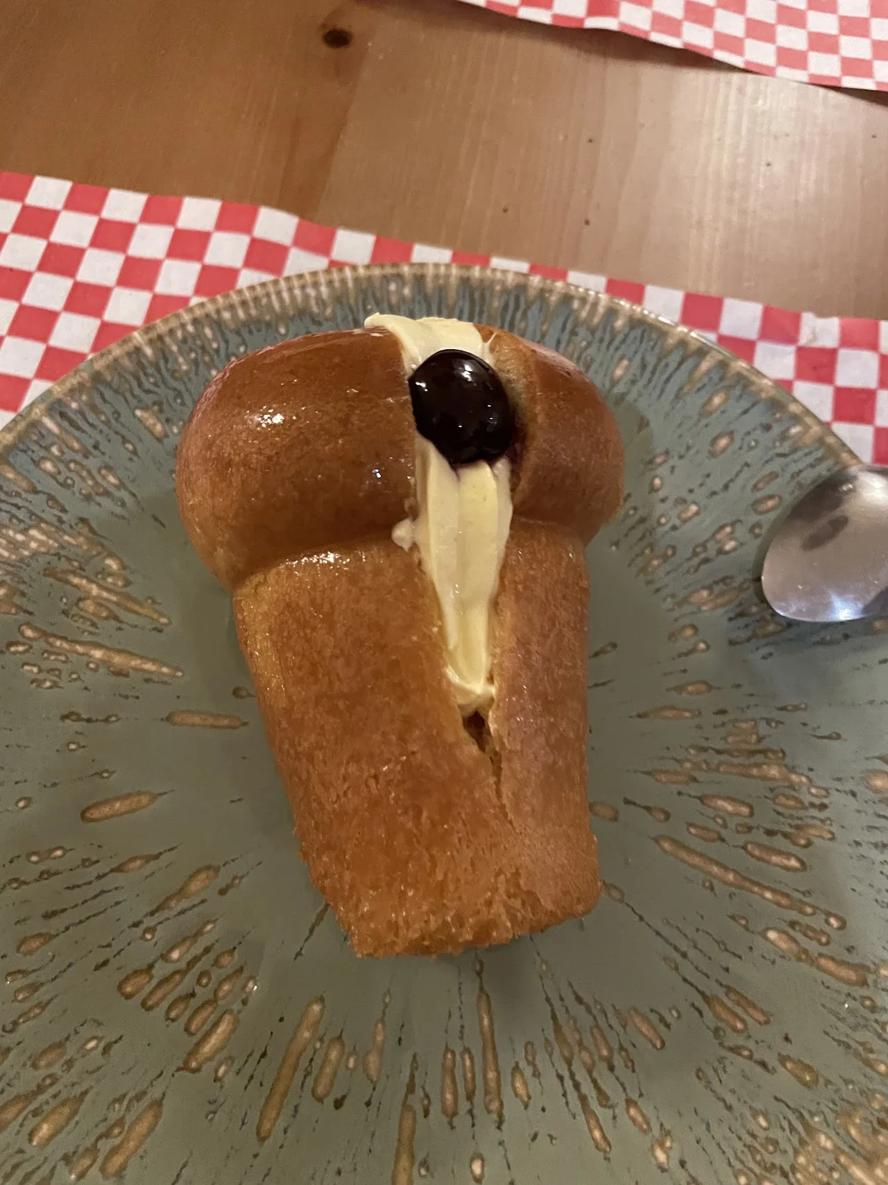 A pastry dessert with a scoop of ice cream on a plate