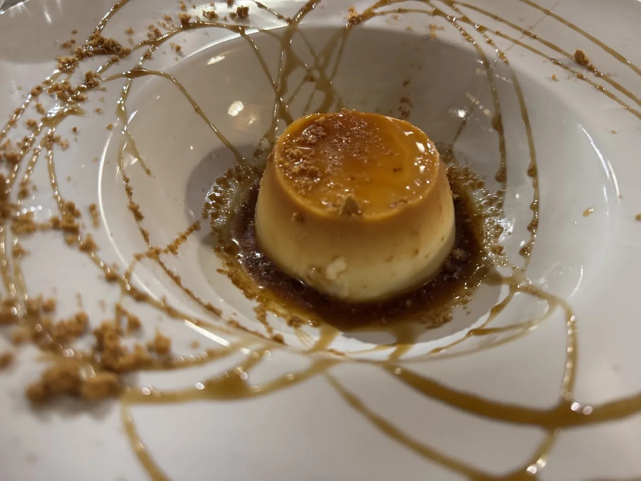 A crème caramel dessert with caramel sauce