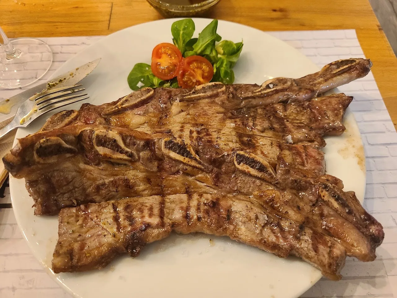 A rack of grilled ribs on a plate