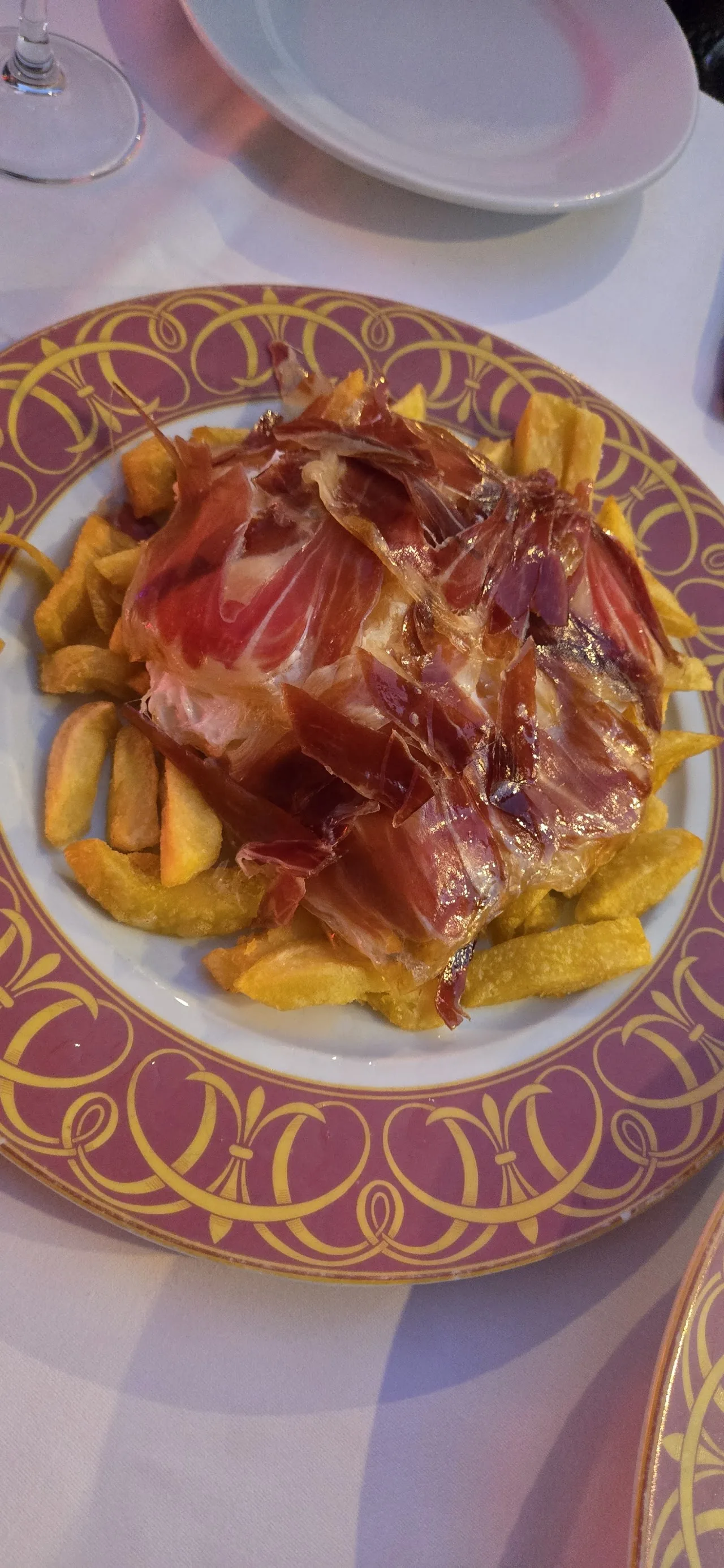 A plate of sliced cured ham