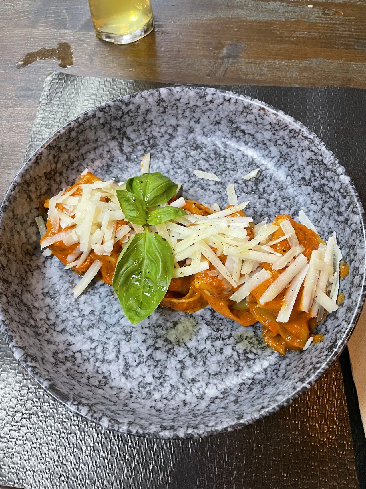 A plate of shredded carrot salad with basil and cheese
