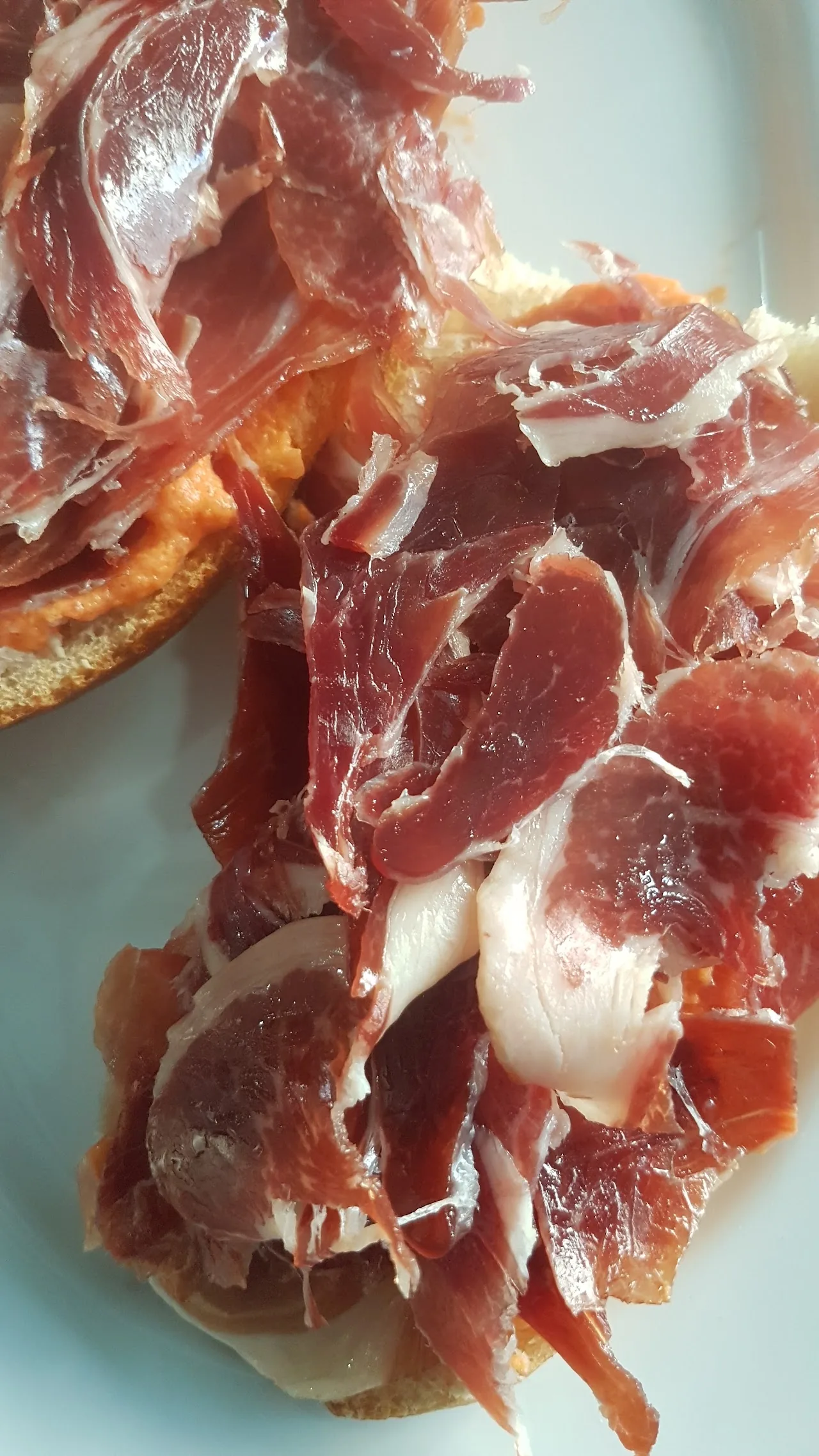 A pile of sliced jamón ibérico