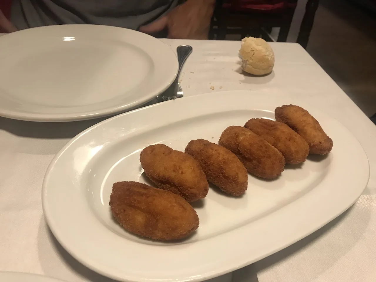 A plate of breaded croquetas