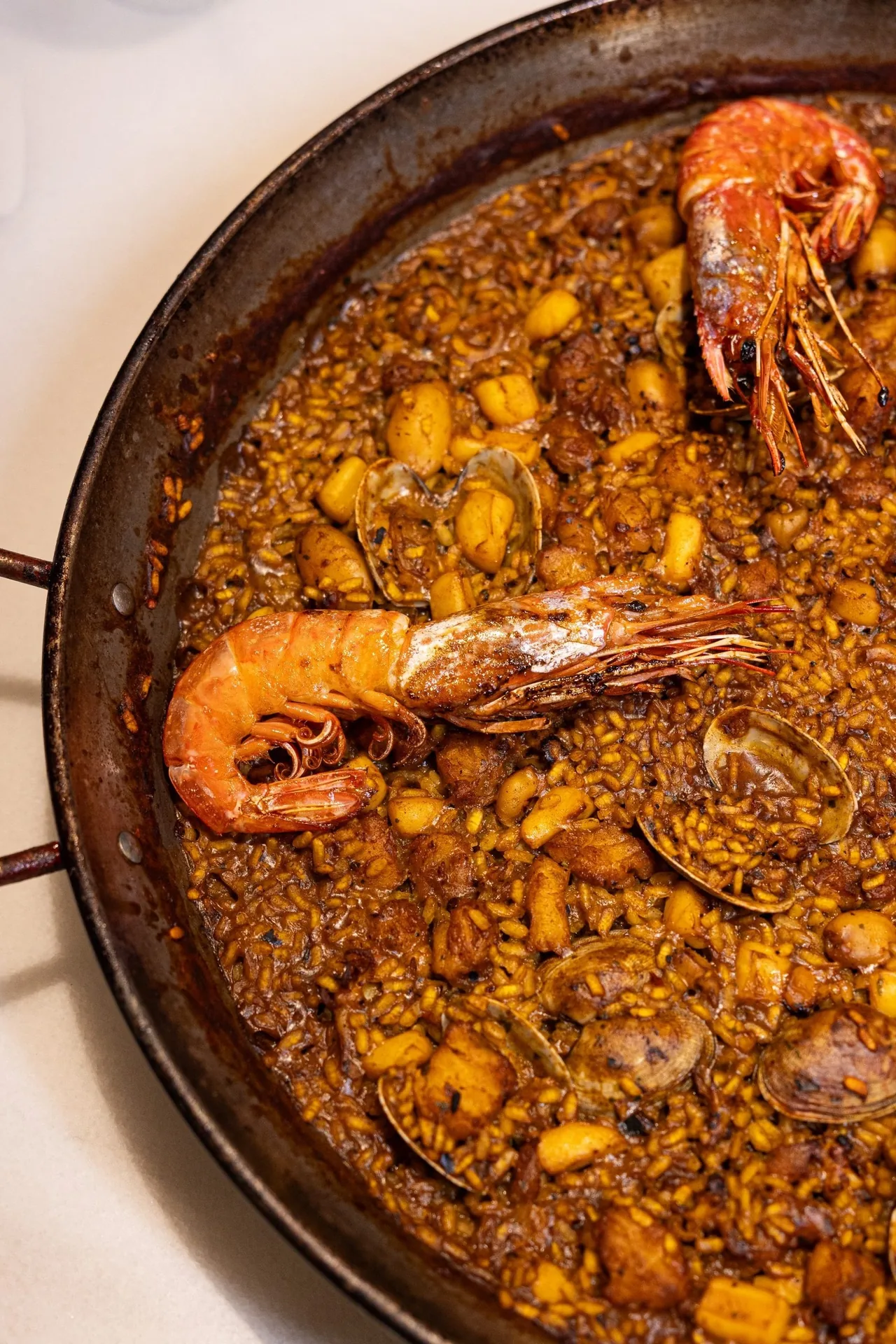 Paella with a carabinero prawn and clams