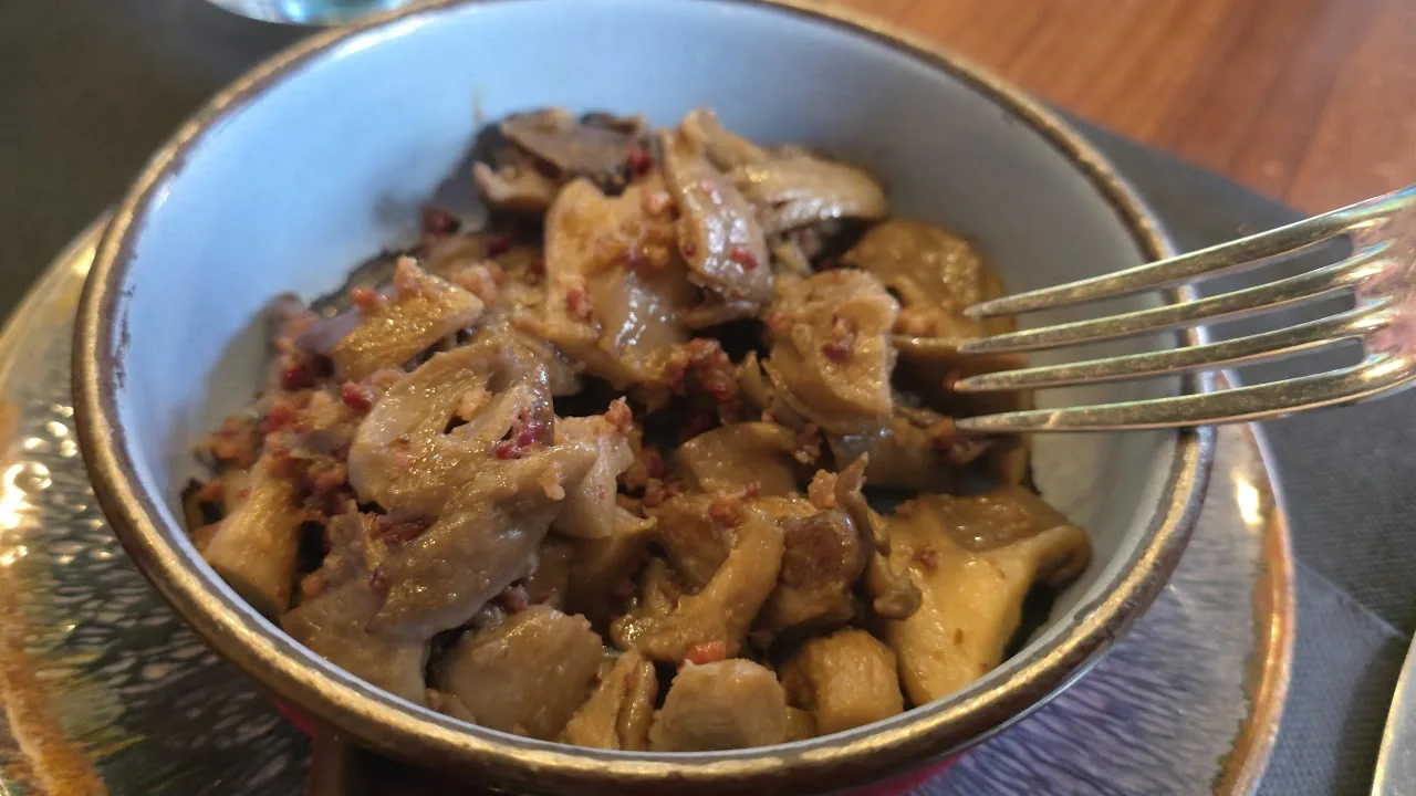 A bowl of sautéed garlic mushrooms