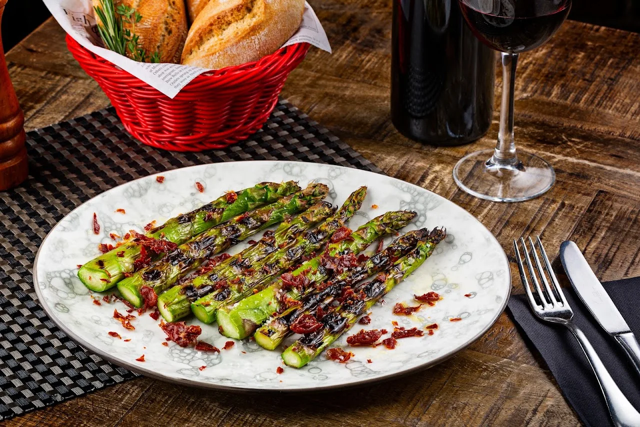 Grilled green asparagus spears drizzled with balsamic reduction