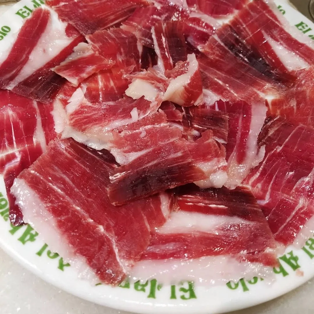A close-up of thinly sliced cured jamon iberico