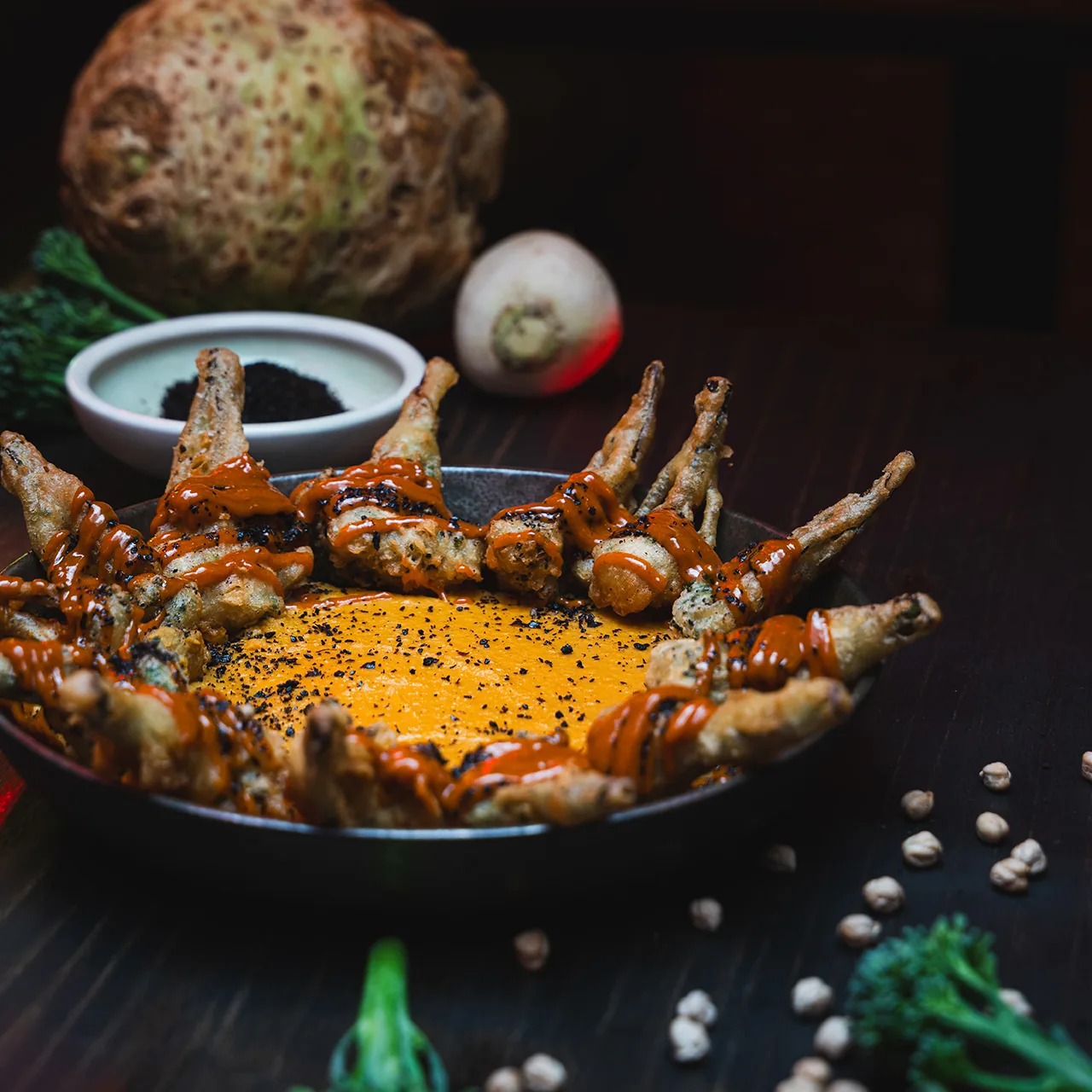 A shellfish dish with orange sauce and herbs