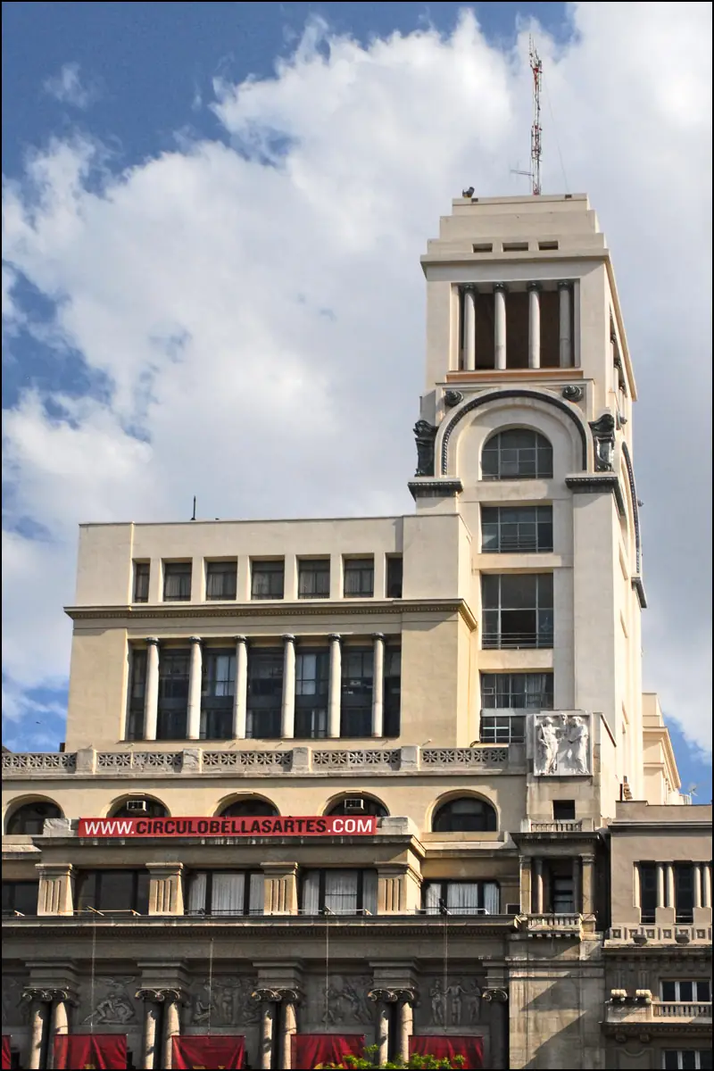The Círculo de Bellas Artes tower with its rooftop belvedere, seen from below with the CirculoBellasArtes.com banner across the lower facade